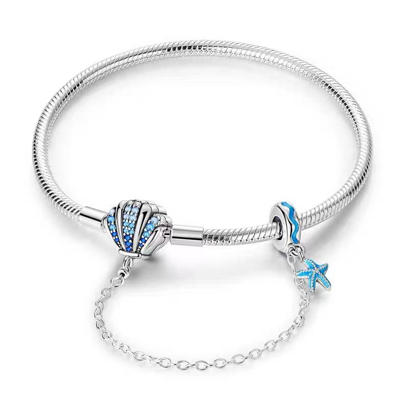 Ocean Shell Pavé Blue CZ Clasp Charm Bracelet — 925 sterling silver snake chain with blue CZ pavé shell clasp, teal enamel wave bead and starfish dangle, silver safety chain